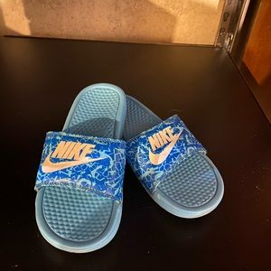 Blue Nike slides